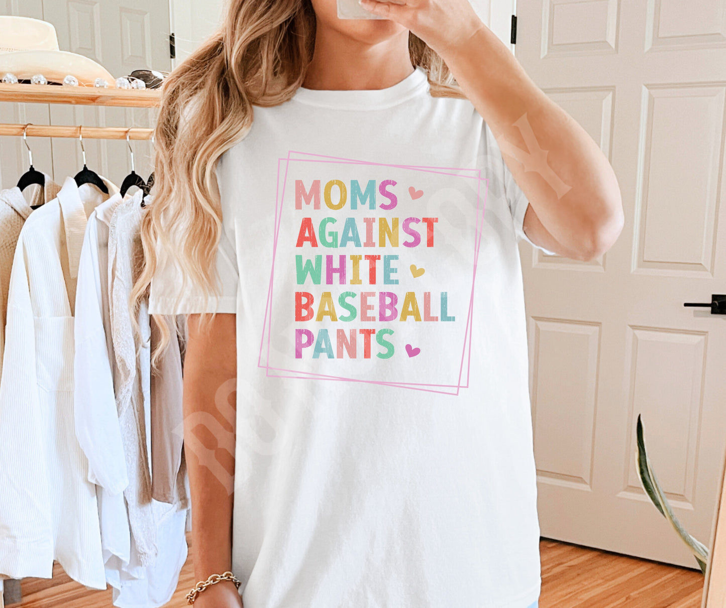 Mom’s against white baseball pants